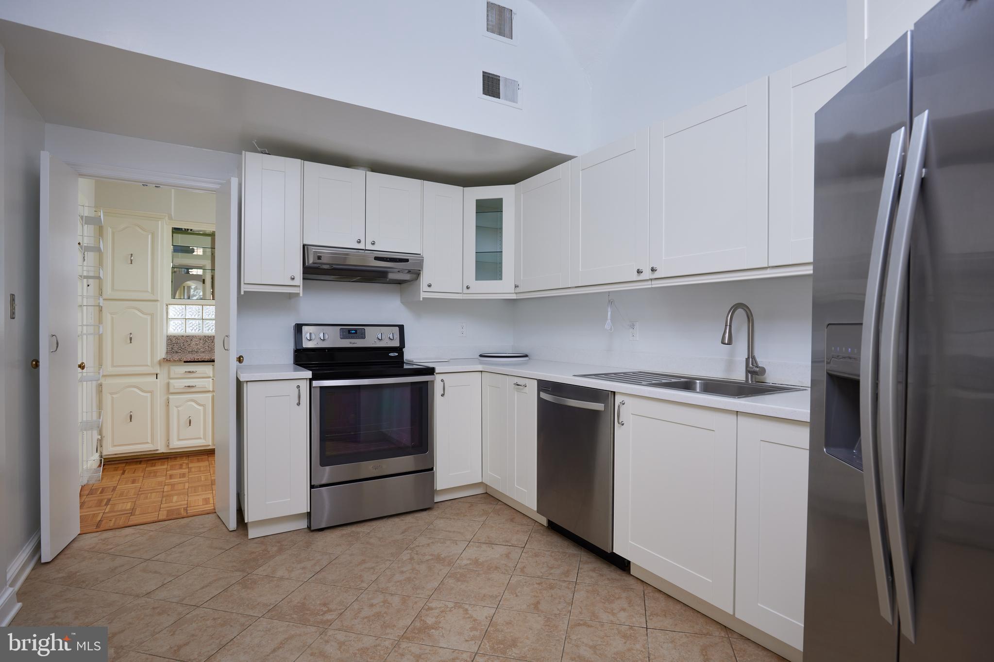 5310 Oakland Road Chevy Chase, MD 20815 - Photo 18 of 45 a kitchen with stainless steel appliances granite countertop a stove a refrigerator and a sink