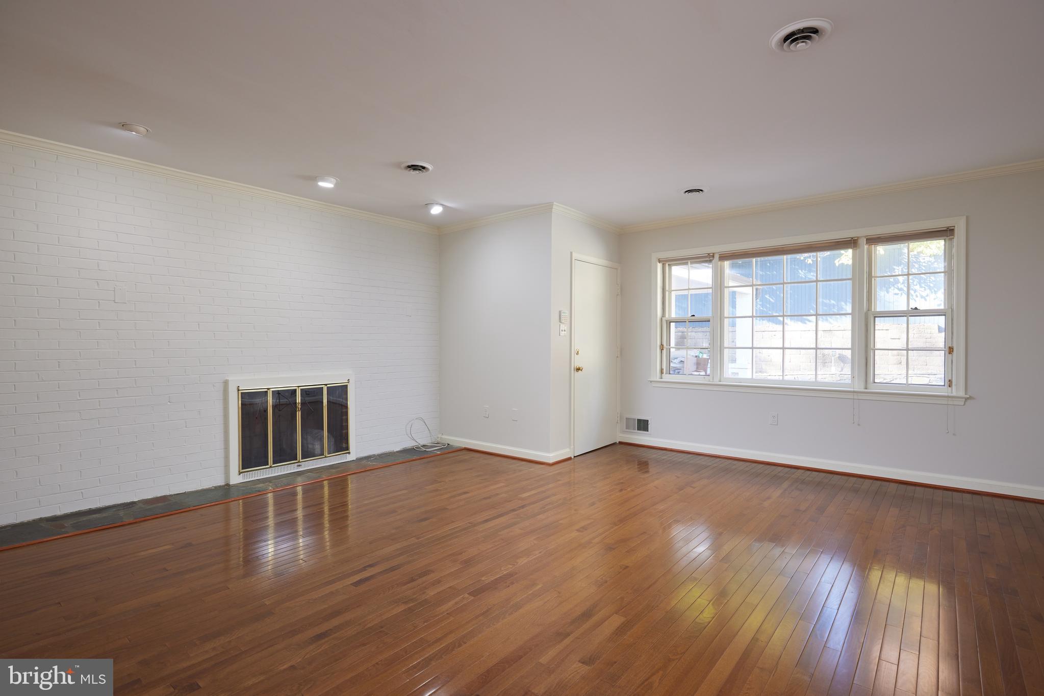 5310 Oakland Road Chevy Chase, MD 20815 - Photo 21 of 45 a view of empty room with wooden floor and fan