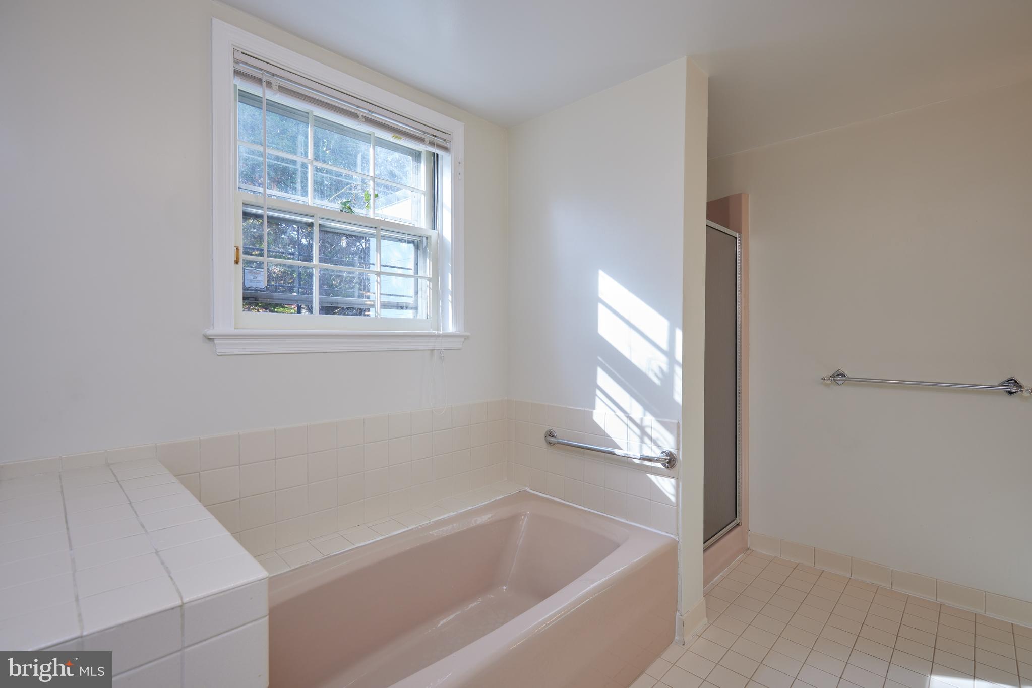 5310 Oakland Road Chevy Chase, MD 20815 - Photo 25 of 45 a white bath tub sitting next to a window