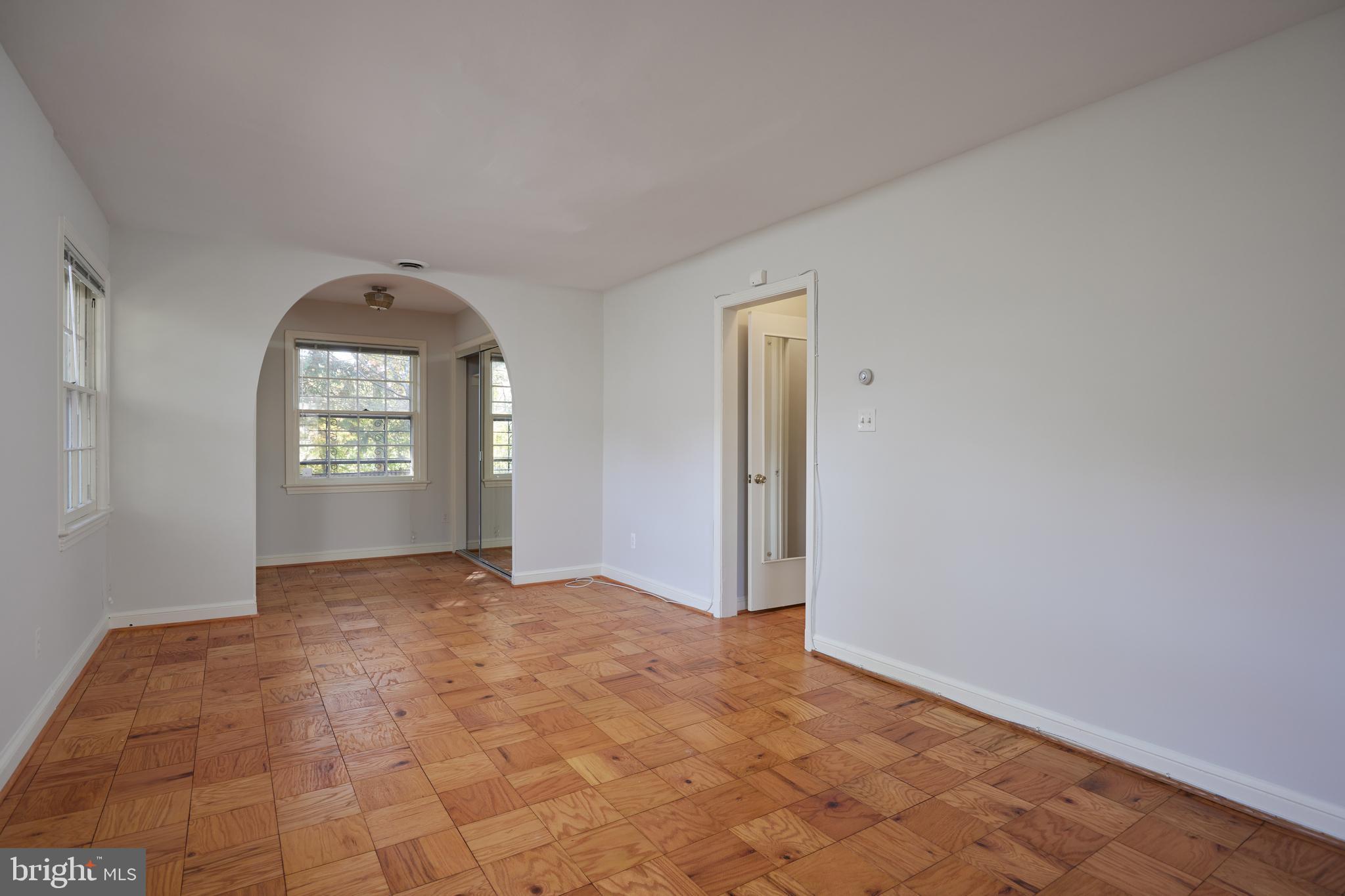 5310 Oakland Road Chevy Chase, MD 20815 - Photo 34 of 45 a view of an empty room with window and bathroom