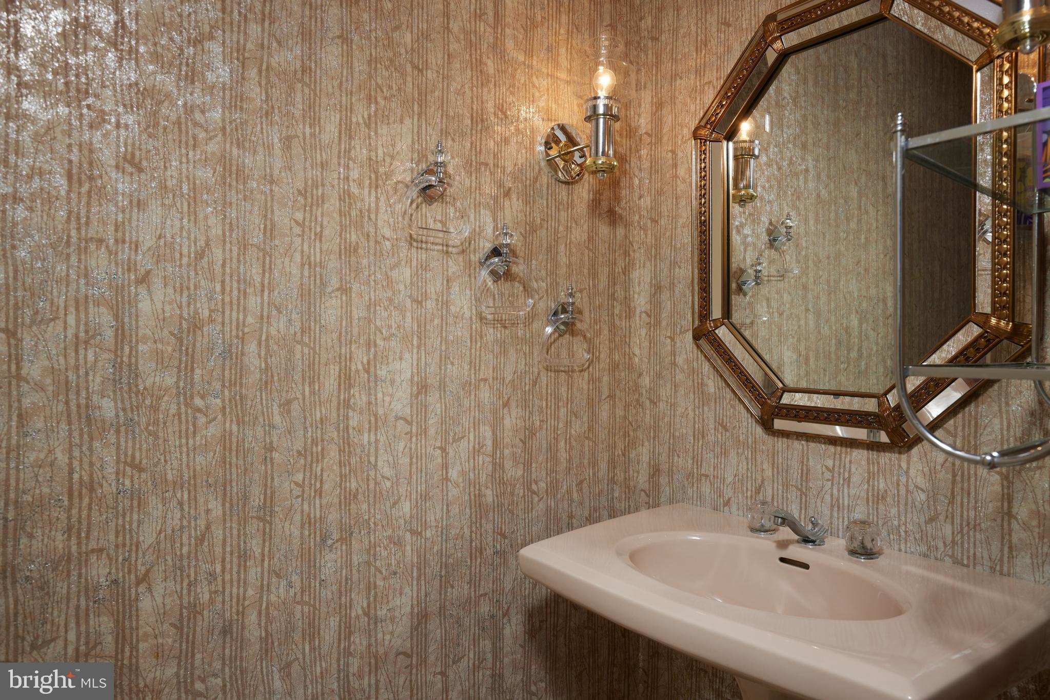 5310 Oakland Road Chevy Chase, MD 20815 - Photo 37 of 45 a bathroom with a sink and mirror