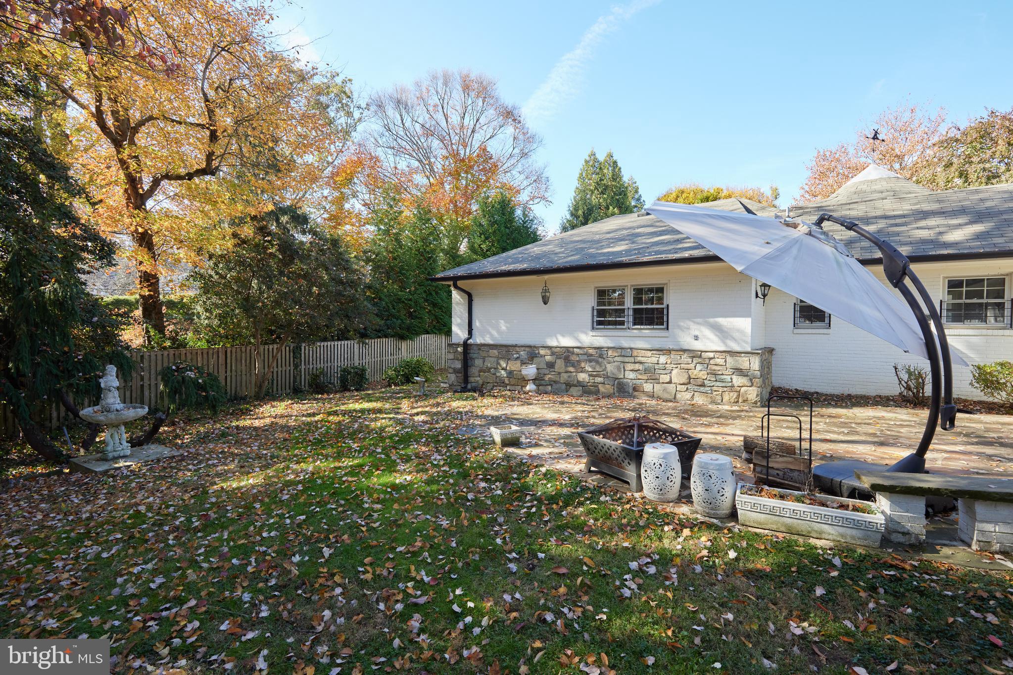 5310 Oakland Road Chevy Chase, MD 20815 - Photo 43 of 45 a backyard of a house with table and chairs