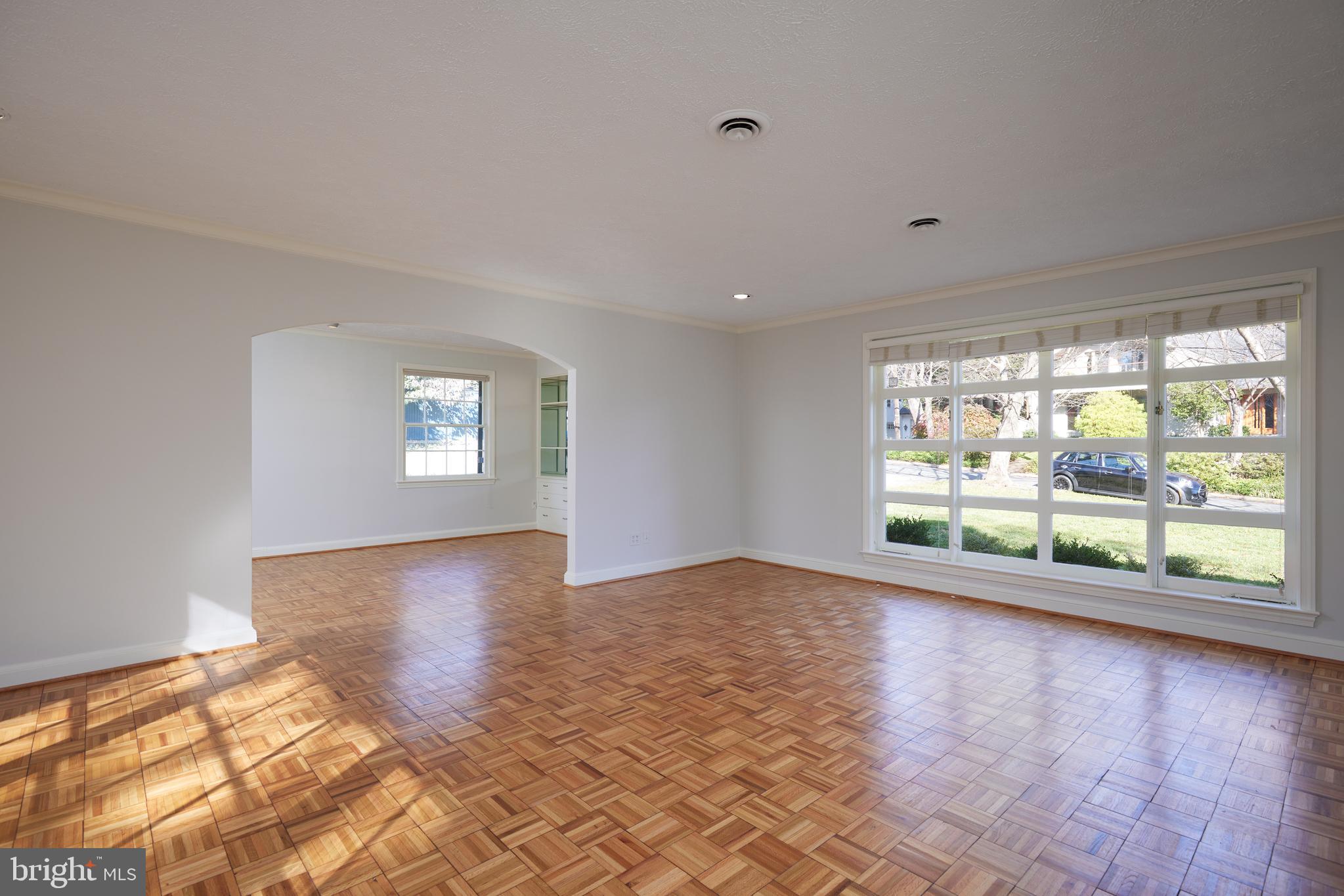 5310 Oakland Road Chevy Chase, MD 20815 - Photo 9 of 45 a view of an empty room with a window and wooden floor