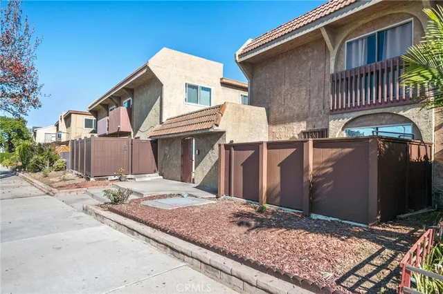 a front view of a house with parking