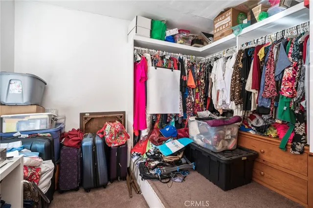 a room with lots of different colored cloths