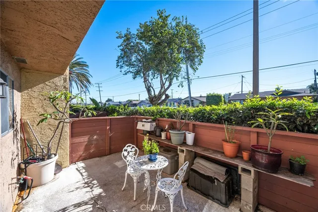 a view of yard from deck with patio