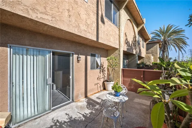 a view of backyard with patio
