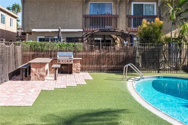 a view of a swimming pool with a patio