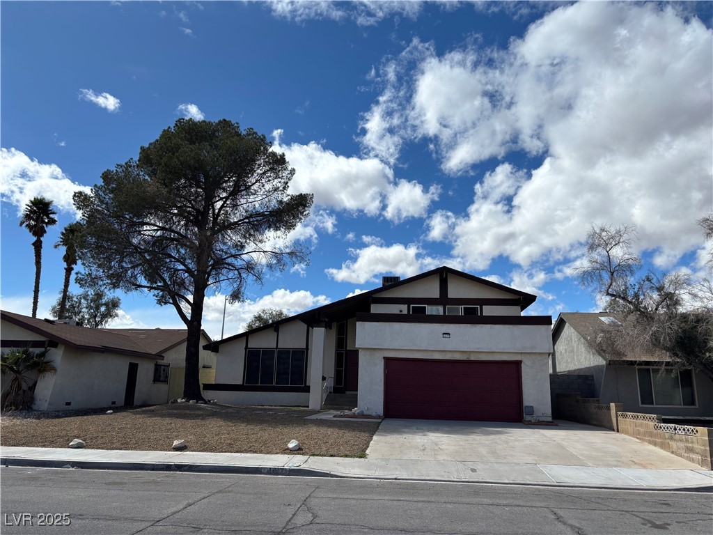 4417 De Forest Street Las Vegas, NV 89103 - Photo 1 of 77 View of front of home with stucco siding, driveway