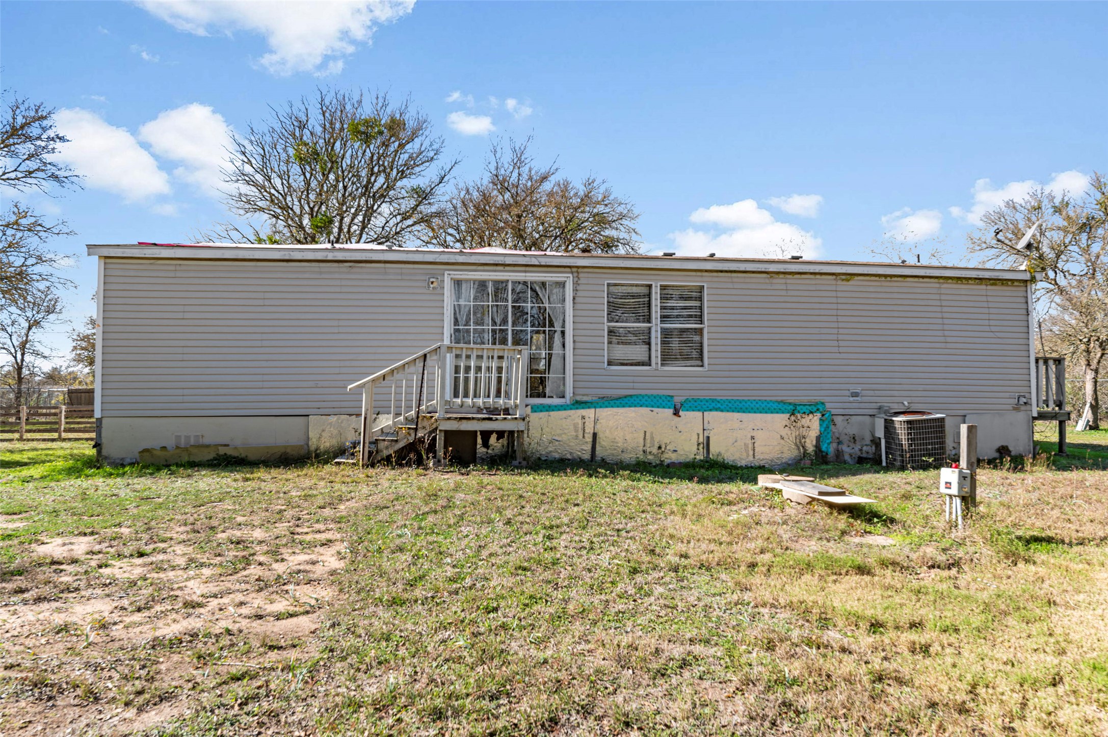 214 The Ranch Road Del Valle, TX 78617 - Photo 32 of 40 Back of property, septic