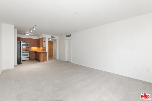 a view of a room with workspace and a sink