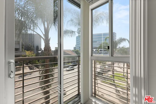 a view of a room with a large window