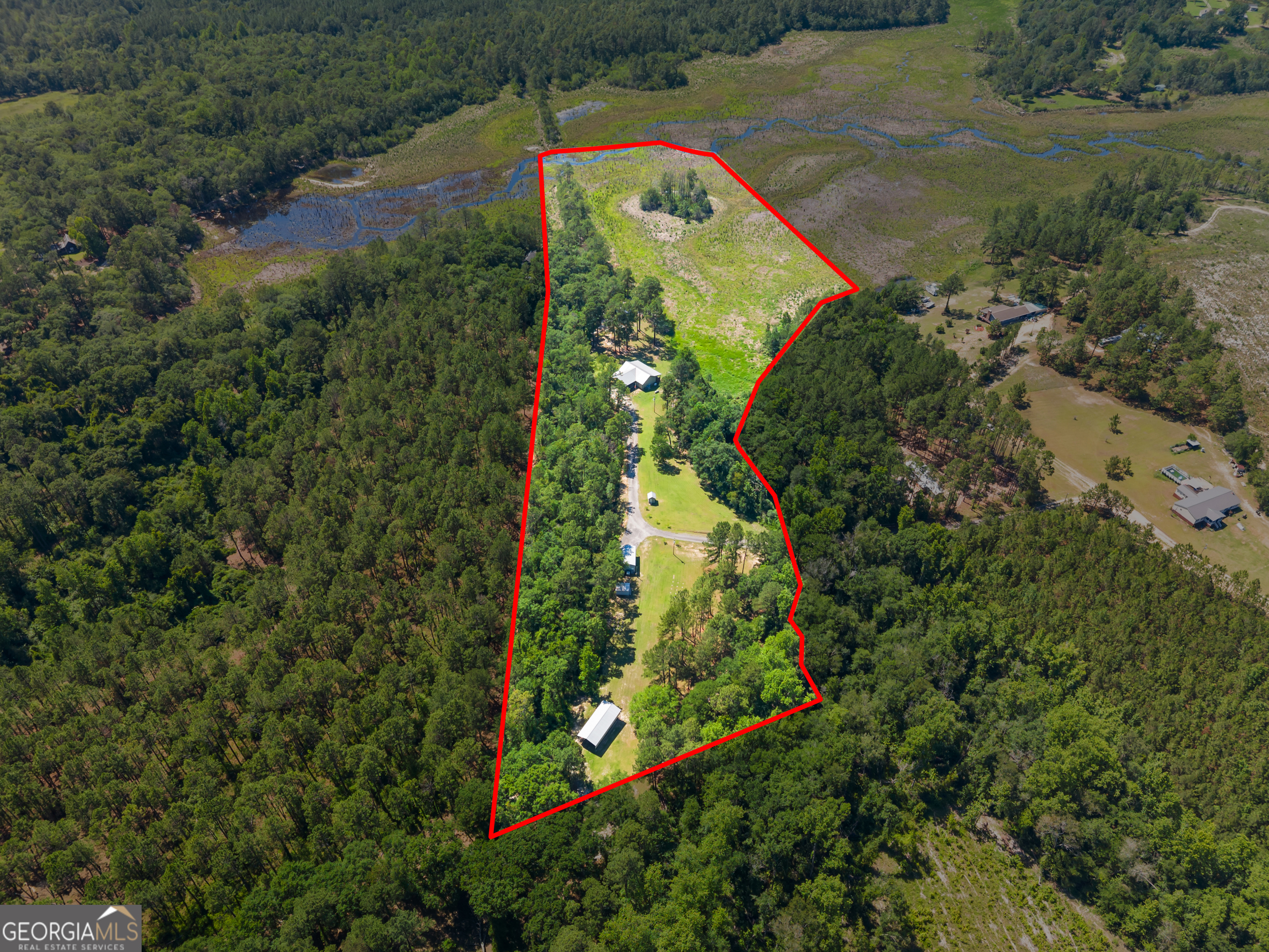 418 Oglesby Pond Road Portal, GA 30450 - Photo 23 of 84 an aerial view of residential houses with outdoor space and trees