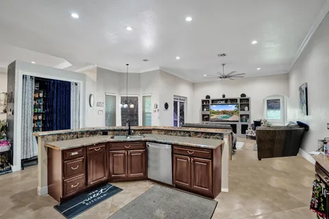 a kitchen with a stove top oven and cabinets