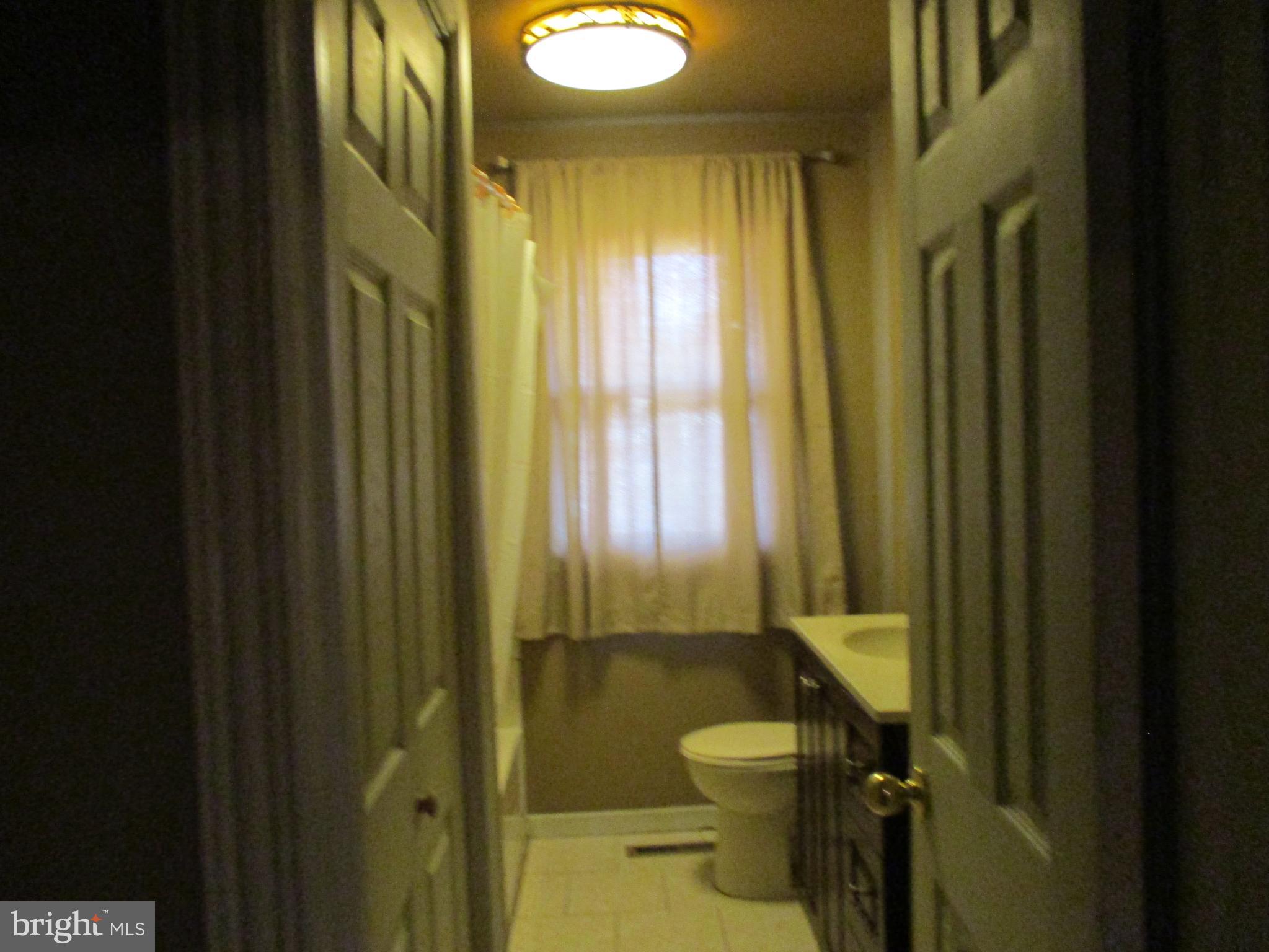 482 Westminster Road Wenonah, NJ 08090 - Photo 19 of 26 a bathroom with a sink mirror vanity and toilet
