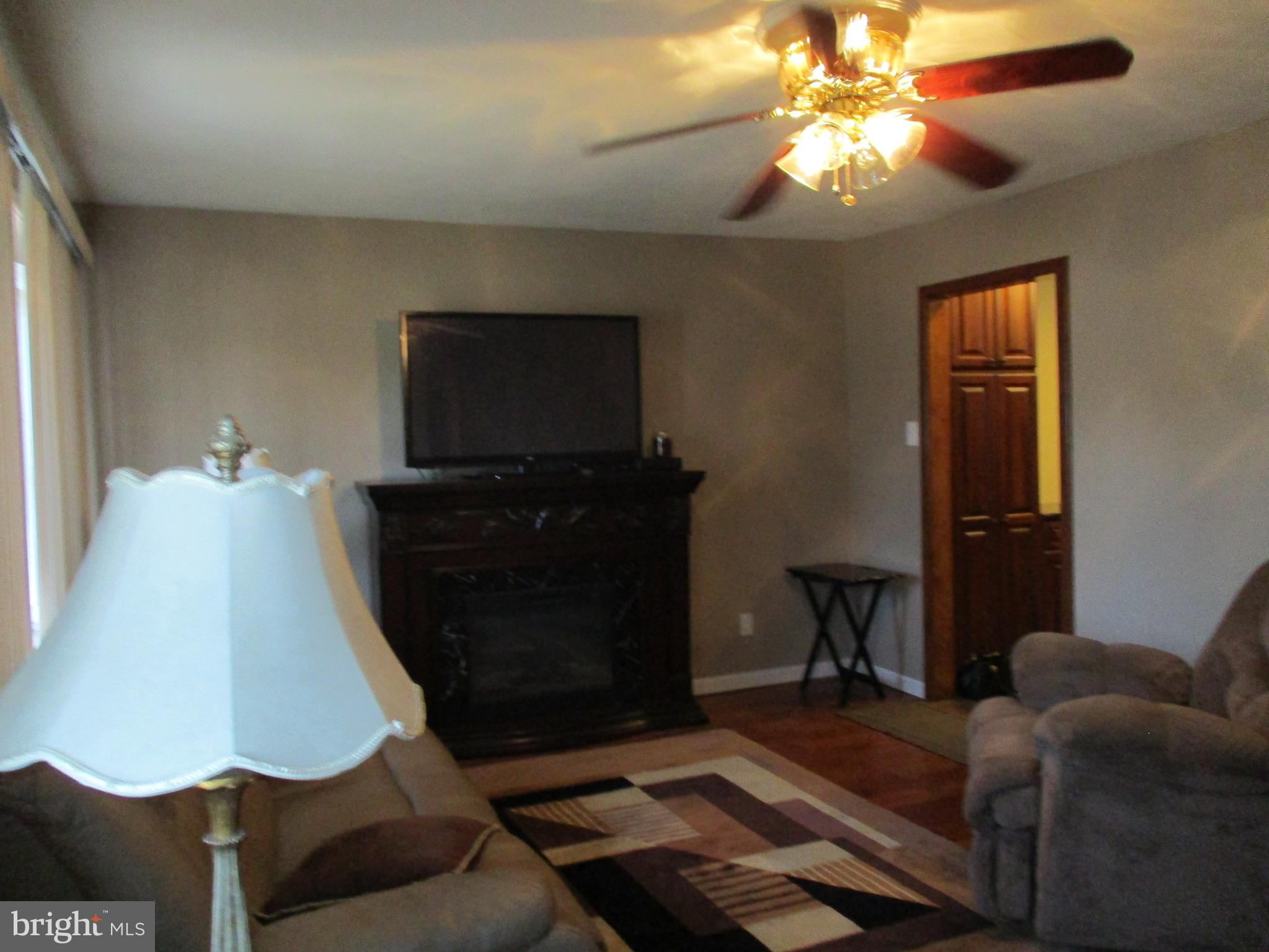 482 Westminster Road Wenonah, NJ 08090 - Photo 10 of 26 a living room with furniture and a flat screen tv