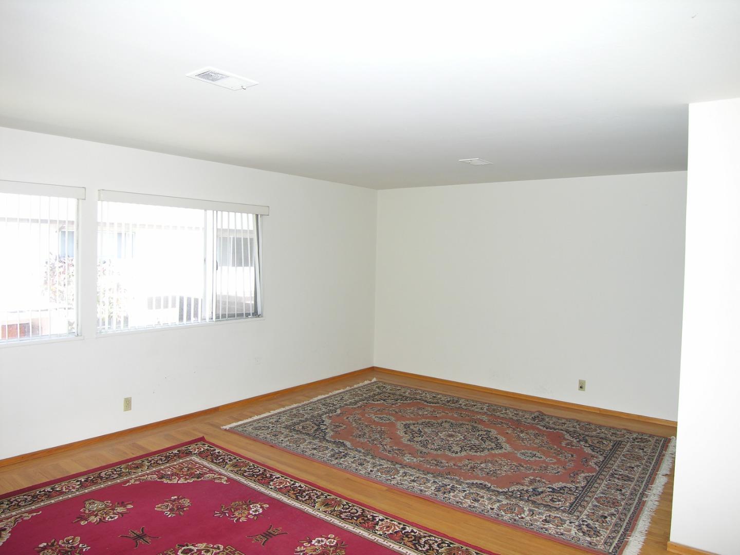 751 Roble Avenue Menlo Park, CA 94025 - Photo 12 of 41 a room with a rug