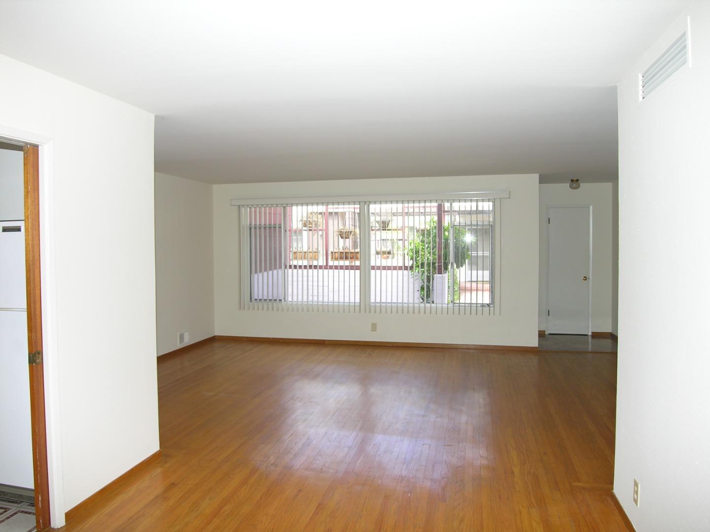 751 Roble Avenue Menlo Park, CA 94025 - Photo 15 of 41 an empty room with wooden floor and windows