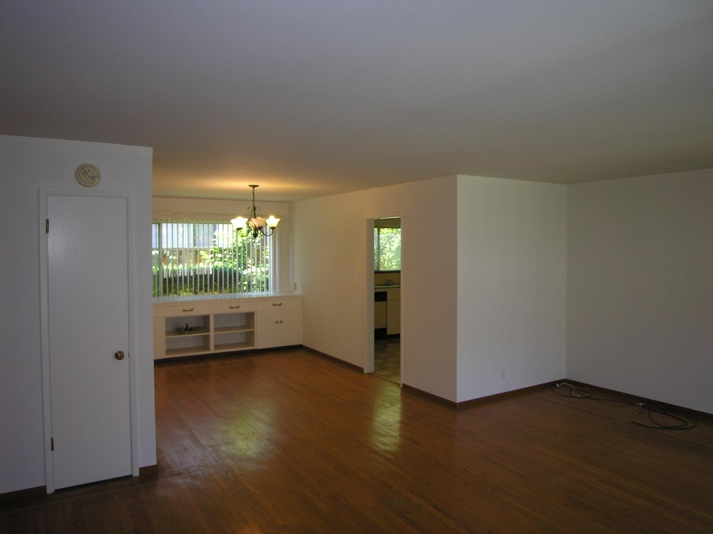 751 Roble Avenue Menlo Park, CA 94025 - Photo 22 of 41 an empty room with wooden floor and windows