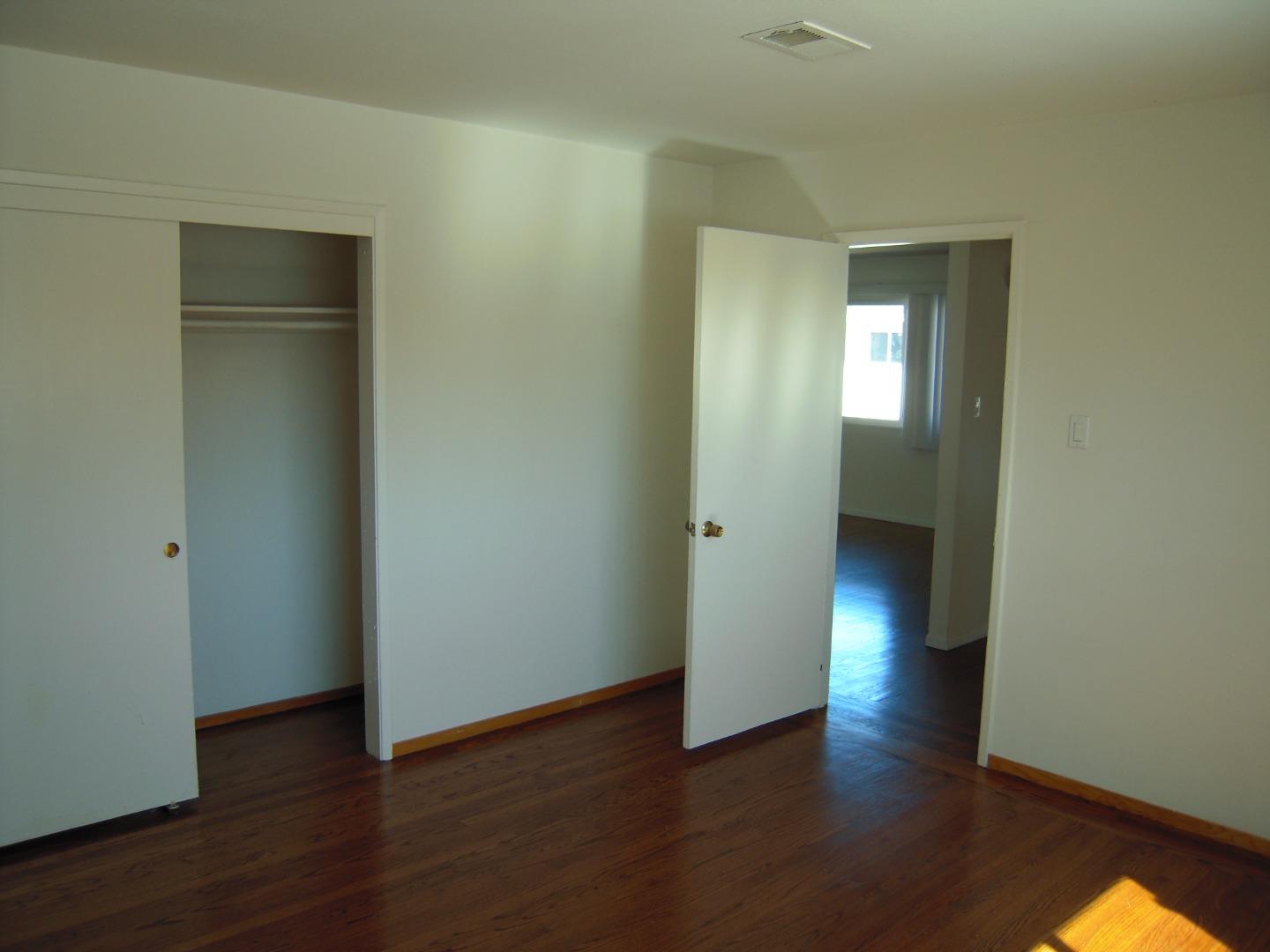 751 Roble Avenue Menlo Park, CA 94025 - Photo 27 of 41 a view of an empty room with wooden floor and closet