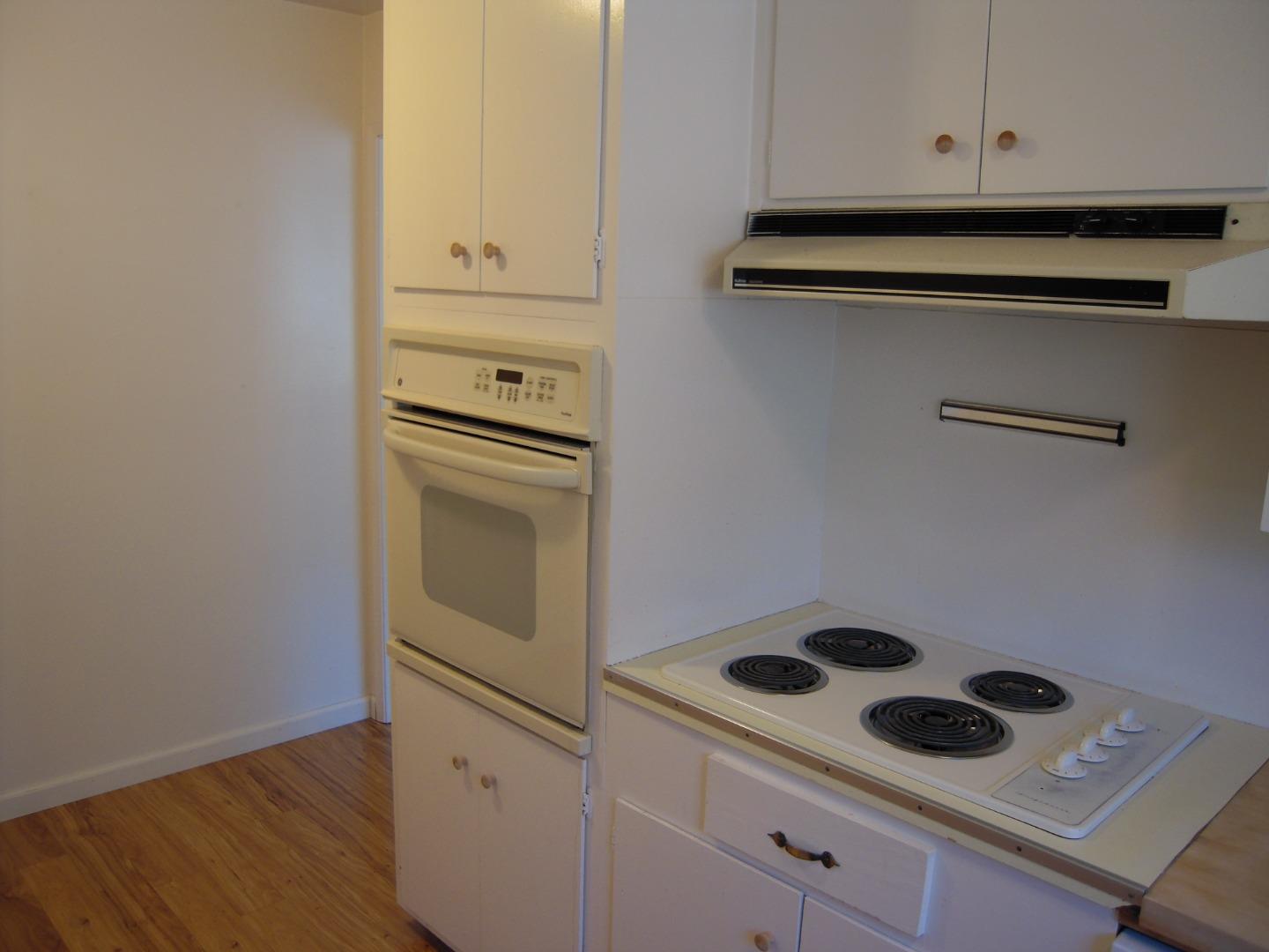 751 Roble Avenue Menlo Park, CA 94025 - Photo 33 of 41 a kitchen with white cabinets and white appliances