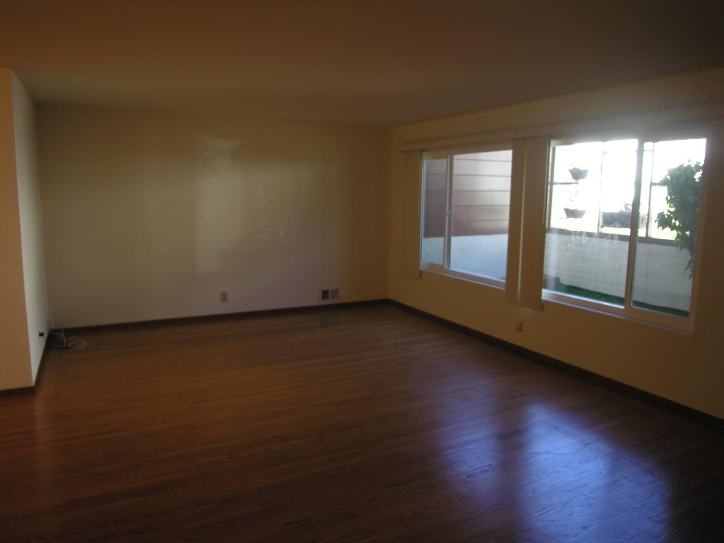 751 Roble Avenue Menlo Park, CA 94025 - Photo 40 of 41 an empty room with wooden floor and windows