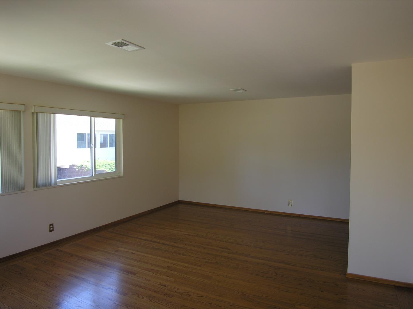 751 Roble Avenue Menlo Park, CA 94025 - Photo 41 of 41 a view of an empty room with wooden floor and a window