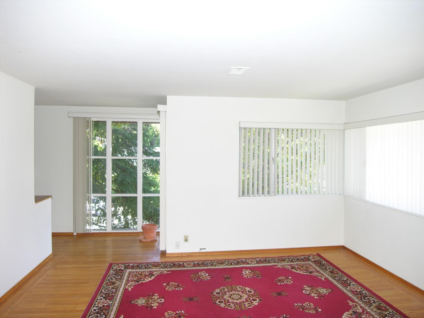 751 Roble Avenue Menlo Park, CA 94025 - Photo 8 of 41 an empty room with wooden floor and window