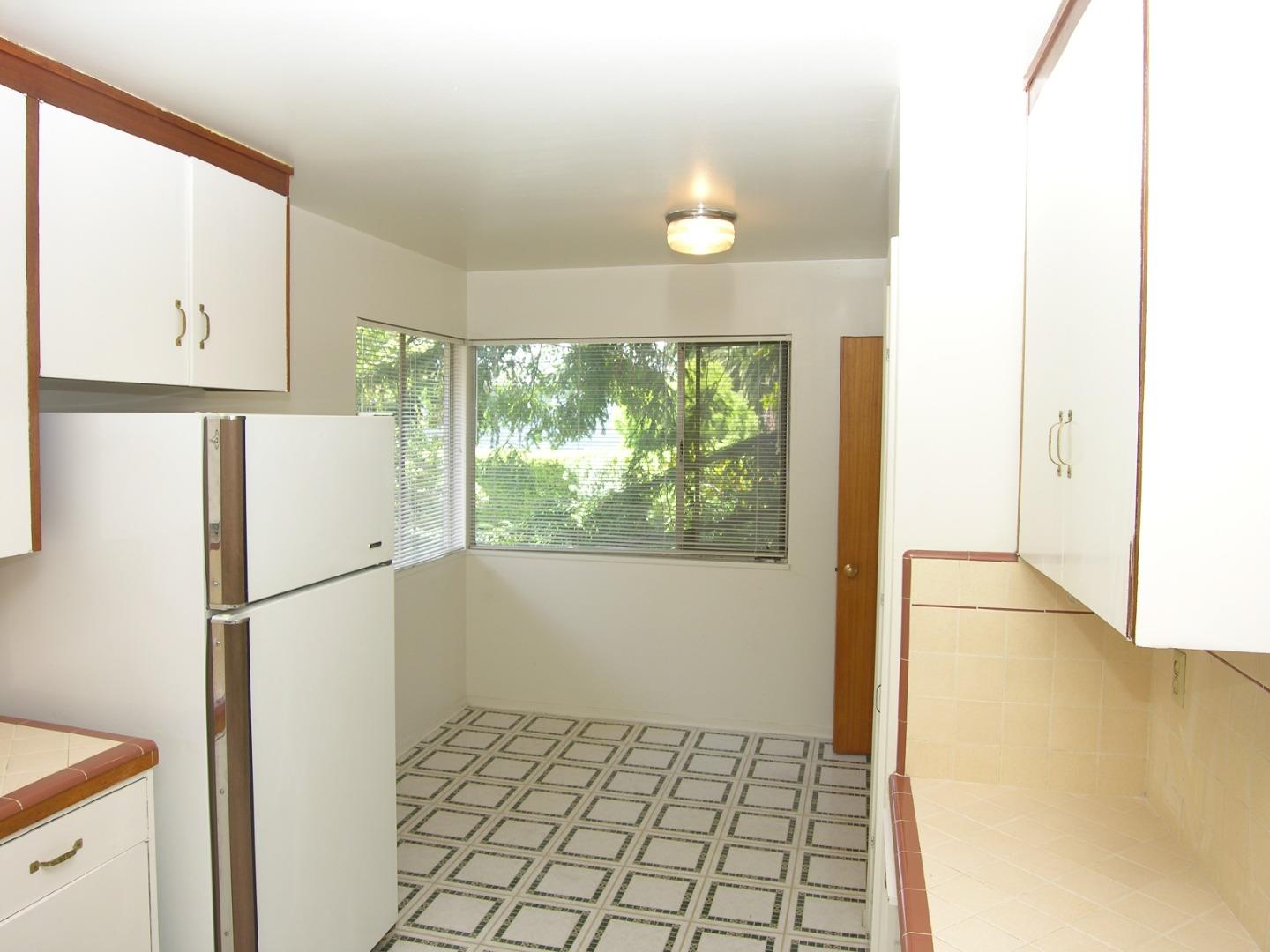 751 Roble Avenue Menlo Park, CA 94025 - Photo 9 of 41 a white refrigerator freezer and a wooden cabinets