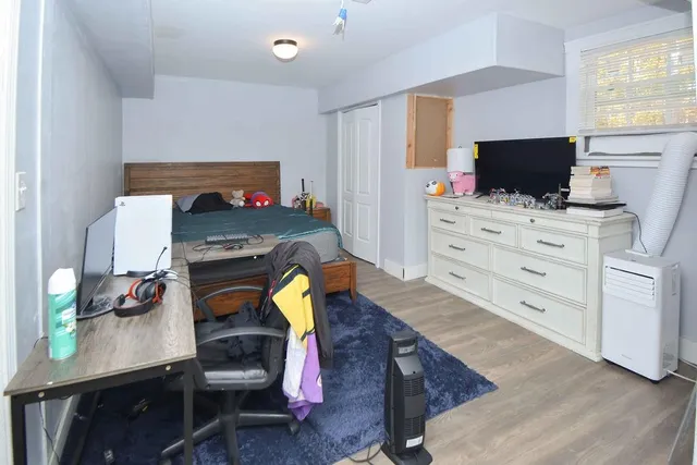 a bedroom with a bed and furniture