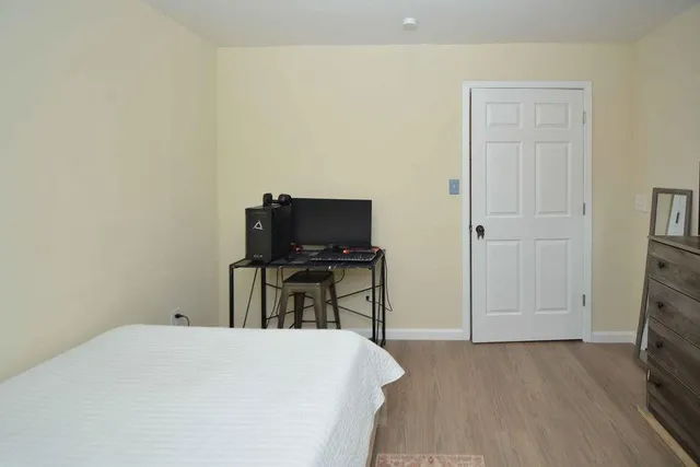 a bedroom with a bed and a television in it