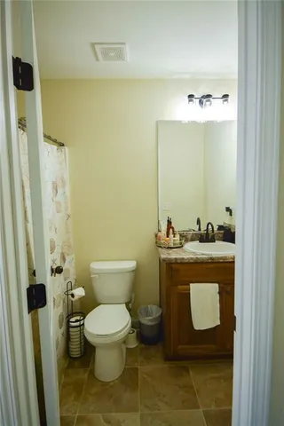 a bathroom with a toilet and a sink