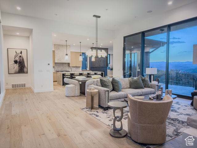 2132 East Outlaw Road, Unit 49 Kamas, UT 84036 - Photo 7 of 44 Living area with a mountain view, light wood-style floors, and recessed lighting