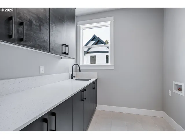 a kitchen with a sink and a window