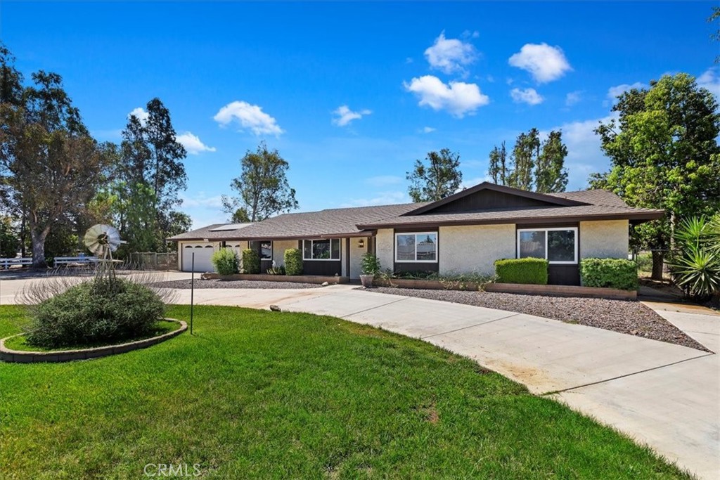 18425 Bert Road Riverside, CA 92508 - Photo 1 of 1 a front view of a house with a garden and porch