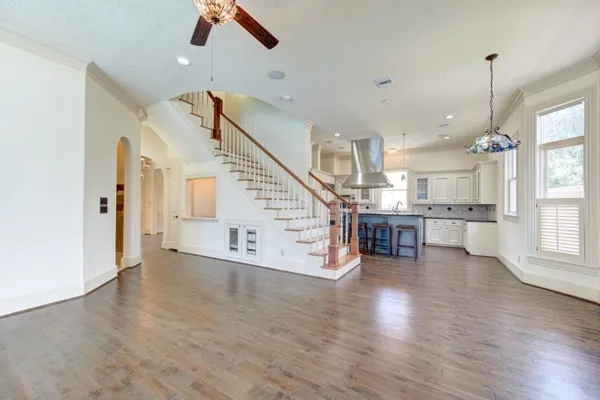 a view of an empty room and wooden floor in a room