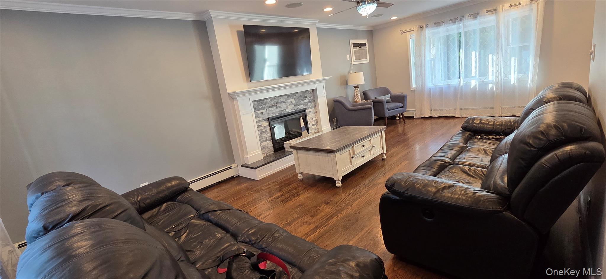 522 Moriches Road St. James, NY 11780 - Photo 8 of 49 a living room with furniture and a fireplace