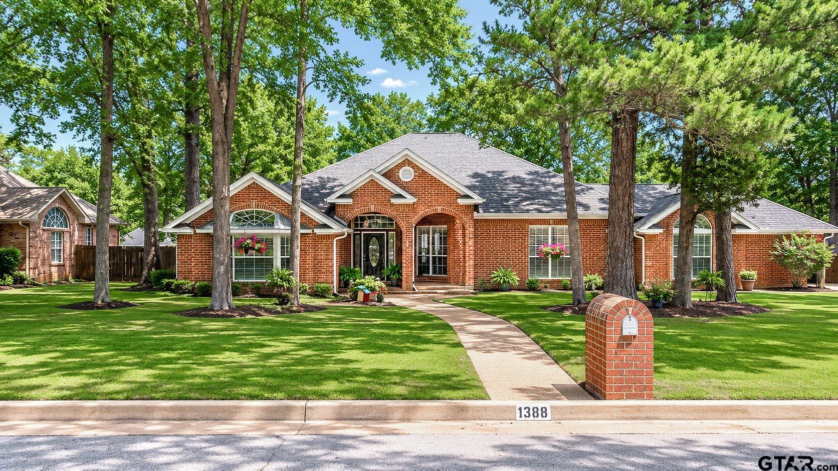 1388 Santa Fe Trail Tyler, TX 75703 - Photo 1 of 46 a front view of a house with a yard