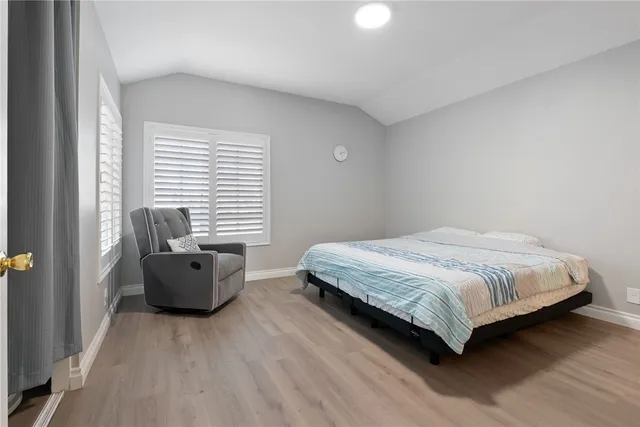 a bedroom with a bed and a couch