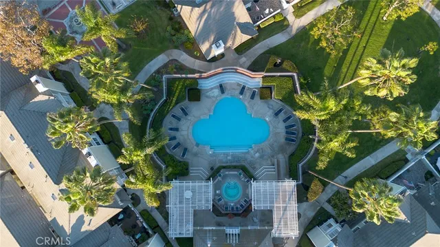 a vase of flowers sitting on a table with chairs