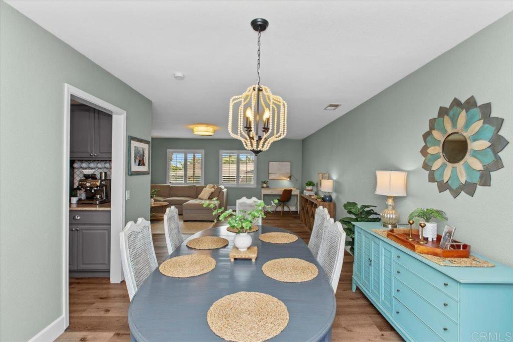 1480 Kurtz Street Oceanside, CA 92054 - Photo 12 of 31 a dining room with furniture a rug and wooden floor