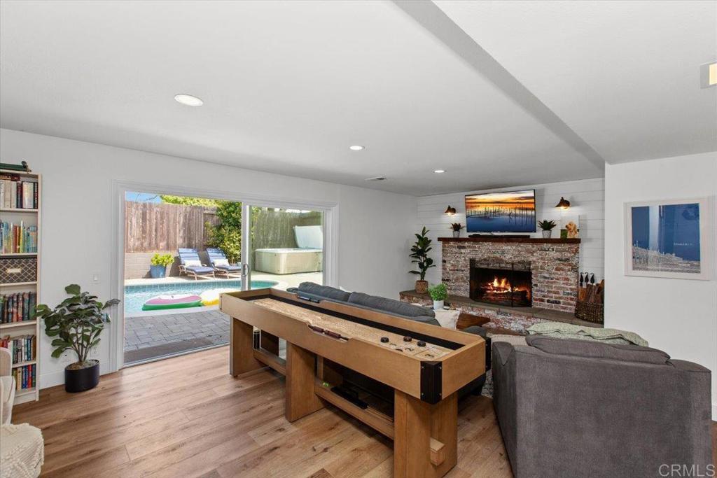 1480 Kurtz Street Oceanside, CA 92054 - Photo 15 of 31 a living room with furniture and a fireplace