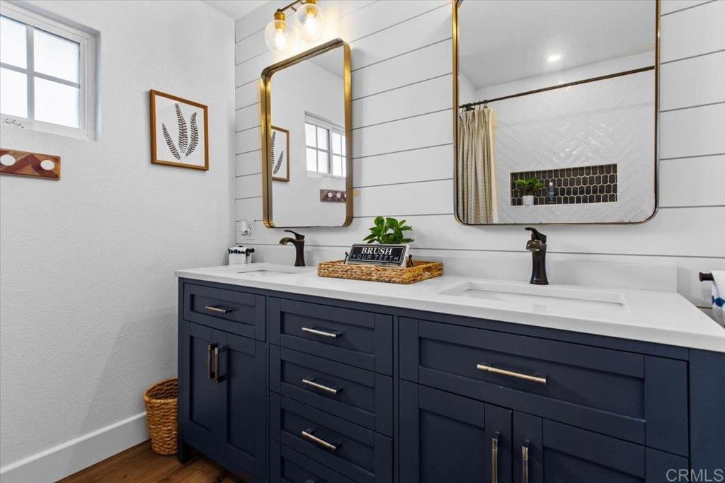 1480 Kurtz Street Oceanside, CA 92054 - Photo 19 of 31 a bathroom with a sink and a mirror