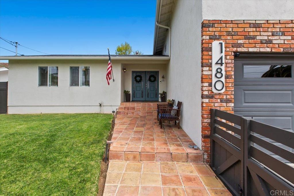 1480 Kurtz Street Oceanside, CA 92054 - Photo 2 of 31 a front view of a house with garden