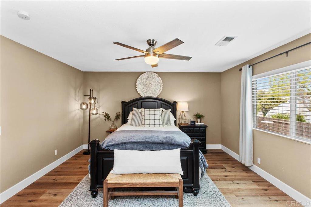 1480 Kurtz Street Oceanside, CA 92054 - Photo 23 of 31 a room with furniture and wooden floor