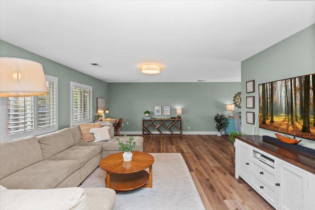 1480 Kurtz Street Oceanside, CA 92054 - Photo 8 of 31 a living room with furniture and a flat screen tv