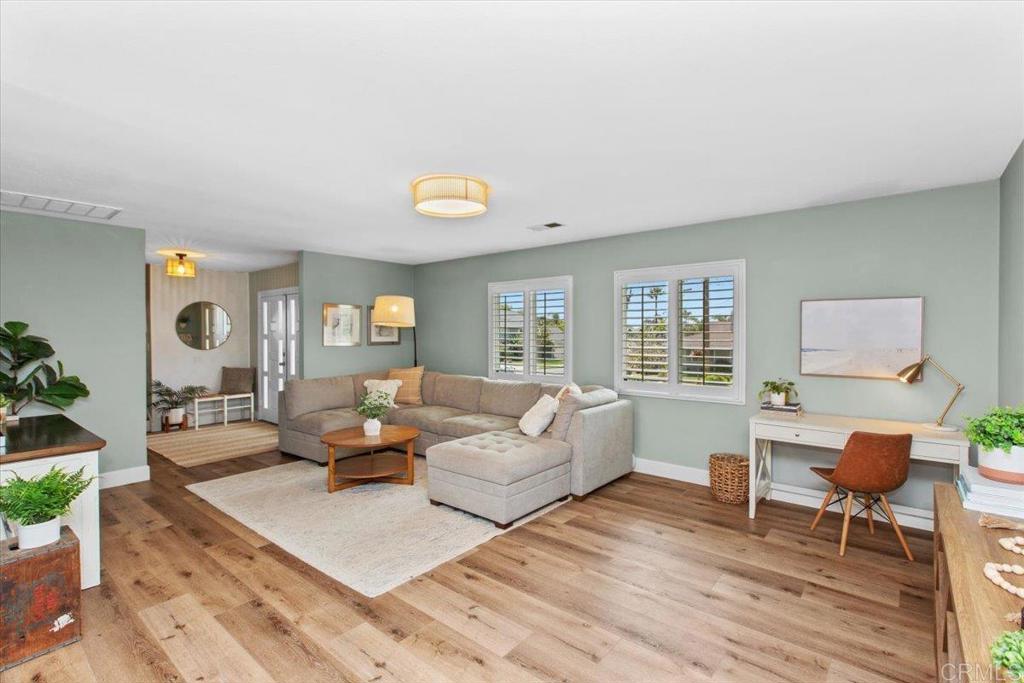 1480 Kurtz Street Oceanside, CA 92054 - Photo 9 of 31 a living room with furniture and wooden floor