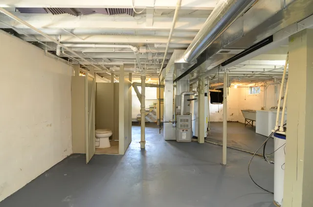 a view of a hallway with wooden shelves