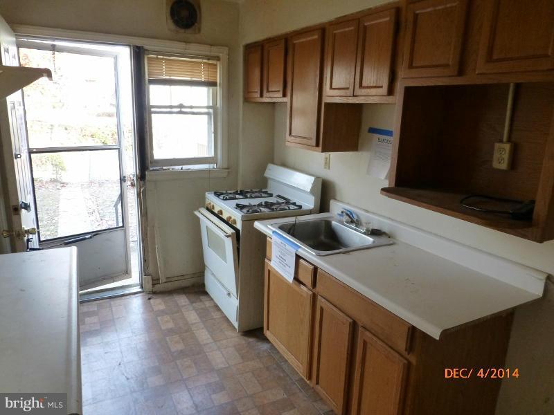 832 Benninghaus Road Baltimore, MD 21212 - Photo 6 of 14 a kitchen with stainless steel appliances a stove a microwave a sink and cabinets