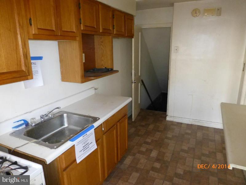 832 Benninghaus Road Baltimore, MD 21212 - Photo 7 of 14 a kitchen that has a sink and a refrigerator